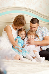 Obraz premium Happy family smiling at home