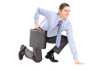 Full length portrait of a businessman with briefcase getting rea