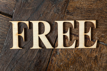 Fototapeta premium Wooden letters on wooden background