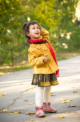 Funny little girl with ice-cream in spring forest