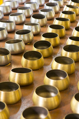 Background of golden and silver color alms bowl
