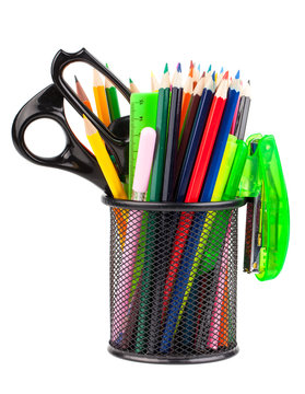 Office cup with scissors, pencils and pens