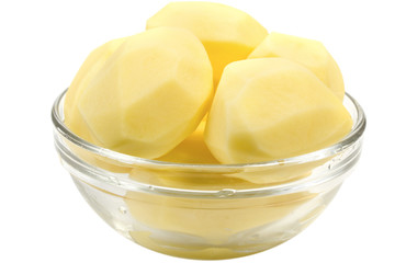 Peeled potatoes in a glass bowl