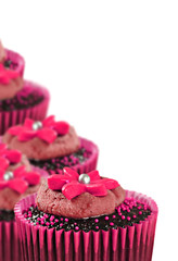 Lovely chocolate cupcakes decorated in pink