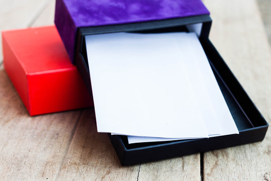 Envelopes in open gift box