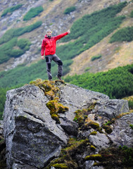 Happy tourist in mountains