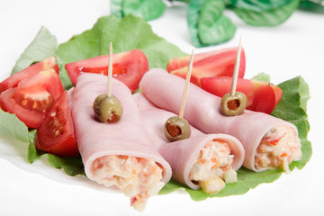 Sliced ham with vegetable salad