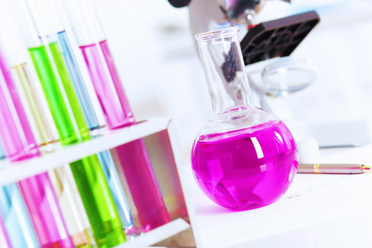Chemistry laboratory glassware with colour liquids