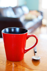 Red coffee mug in home decor