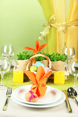 Easter table setting on color background