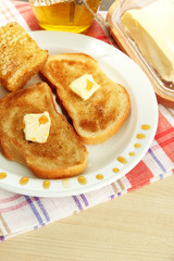 White bread toastwith honey on plate in cafe