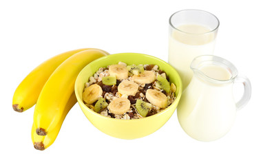 Delicious and healthy cereal in bowl with milk and fruit