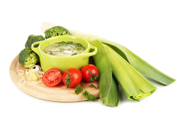 Diet soup with vegetables in pan isolated on white