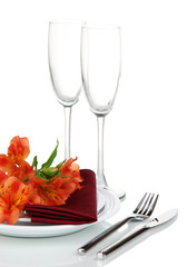 Festive table setting with flowers isolated on white