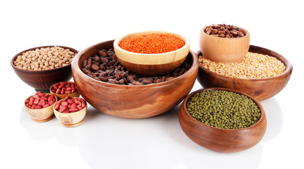 Different kinds of beans in bowls isolated on white