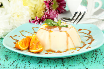 Panna Cotta with orange zest and caramel sauce,