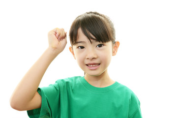 ガッツポーズをする笑顔の女の子