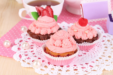 Beautiful strawberry cupcakes and flavored tea
