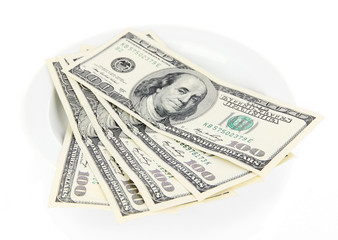 Money on plate isolated on white