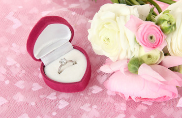 Ranunculus (persian buttercups) and engagement ring,