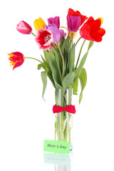 Beautiful tulips in bouquet with note isolated on white