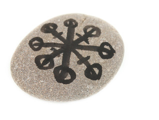 Fortune telling  with symbols on stone isolated on white