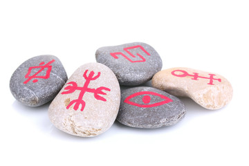 Fortune telling  with symbols on stones isolated on white