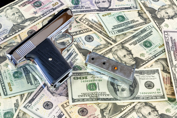 Semi Automatic Pistol on a pile of cash