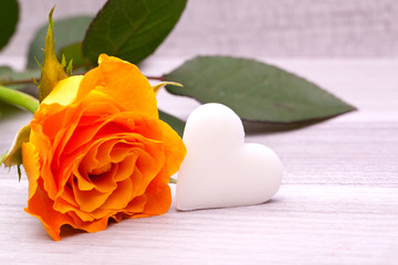 single yellow rose with white sugar heart decoration