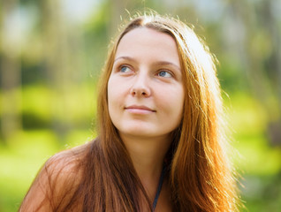 Fototapeta premium Portrait of young beautiful woman outdoors