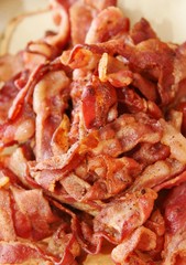 Crispy grilled bacon strips piled high