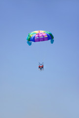 paragliding in the clear sky