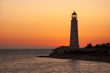 Bright sea sunset panorama above the beacon tower
