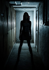 Beautiful girl in dark basement