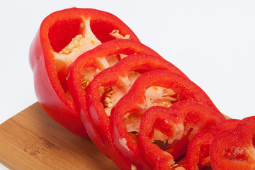 Sliced red pepper isolated on white background