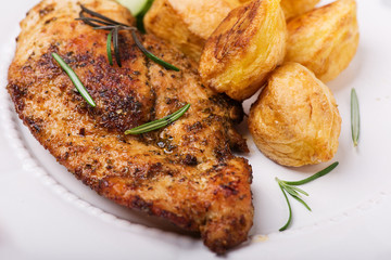 oven baked chicken fillet with potatoes © Kamila Cyganek