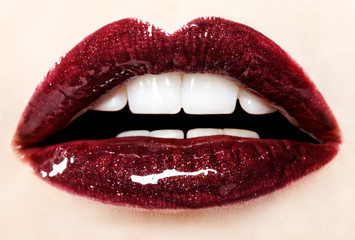 Beautiful red glossy lips close up
