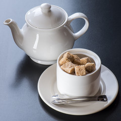 white tiapot with sugar bowl