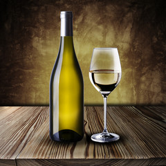 Bottle and glass of white wine on wood table