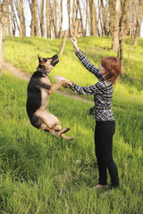 Young woman training her dog