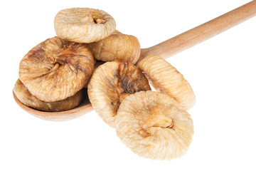 Dried figs in a wooden spoon