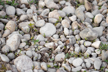 background of stone rubble in the grass