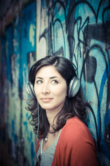 Fototapeta premium Beautiful stylish woman listening to music