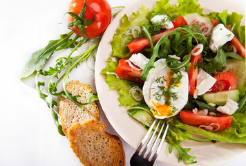 Light spring salad with poached egg