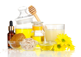 Fragrant honey spa with oils and honey isolated on white
