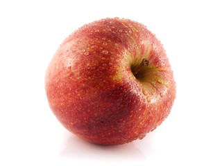 Isolated fresh red apple with water drops.