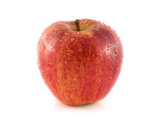 Isolated fresh red apple with water drops.