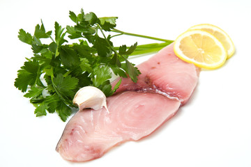 swordfish with lemon and parsley on white