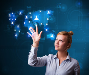 Beautiful businesswoman choosing from social network map