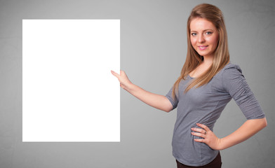 Young woman presenting white paper copy space